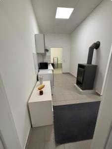 a room with a kitchen with a stove at Menzel Wohnungen in Beckingen