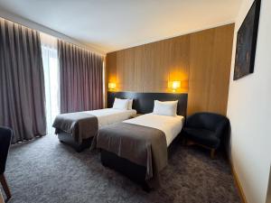 Ένα ή περισσότερα κρεβάτια σε δωμάτιο στο GAZDA Hotel&Restaurant - Self Chek-In