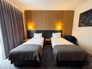 Ένα ή περισσότερα κρεβάτια σε δωμάτιο στο GAZDA Hotel&Restaurant - Self Chek-In