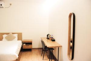 Postel nebo postele na pokoji v ubytování 厦门鼓浪屿湾景酒店