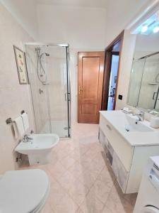 a bathroom with a toilet and a sink and a shower at Il Limoneto in Furore +21 photos