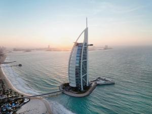 an aerial view of the burj al arab hotel in the ocean at Jumeirah Burj Al Arab Dubai in Dubai