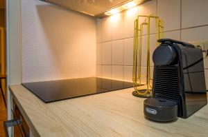 a hair dryer on a counter in a room at Appartement Luna in Magdeburg