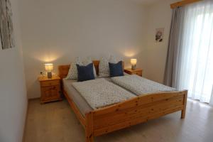 A bed or beds in a room at Ferienwohnung Hausleitner