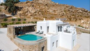 an aerial view of a villa with a swimming pool at Villa Camelia 2 - Psarou View - Private pool and Jacuzzi in Mýkonos City