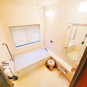 Koupelna v ubytování Guesthouse & Sharehouse カリマ安曇沓掛