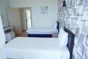 Postel nebo postele na pokoji v ubytování Inebolu Gardenya Hotel