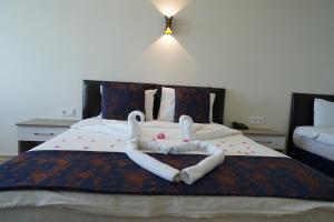 Postel nebo postele na pokoji v ubytování Inebolu Gardenya Hotel