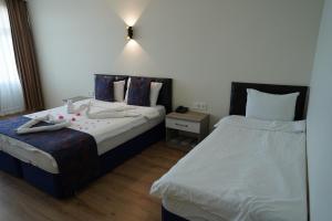 Postel nebo postele na pokoji v ubytování Inebolu Gardenya Hotel