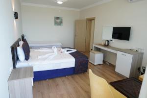 Postel nebo postele na pokoji v ubytování Inebolu Gardenya Hotel