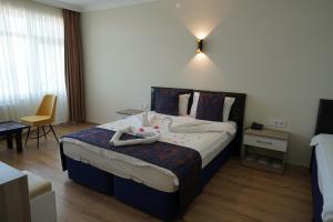 Postel nebo postele na pokoji v ubytování Inebolu Gardenya Hotel