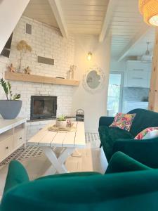 a living room with a couch and a table at Tajemnicza Kraina in Wetlina