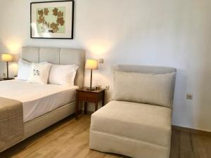 A bed or beds in a room at Aegean Blue Horizon