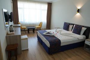 Postel nebo postele na pokoji v ubytování Inebolu Gardenya Hotel