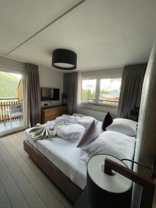 Postel nebo postele na pokoji v ubytování Boutique Hotel die Mittagspitze Superior + 37 fotografií