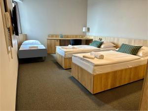 Postel nebo postele na pokoji v ubytování Hotel D1