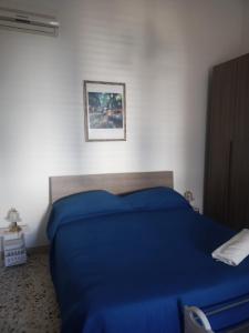 Giường trong phòng chung tại B&B Casa Rosati