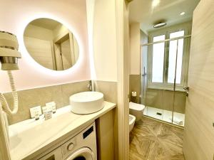 Koupelna v ubytování Hotel Astigiana & Appartamenti