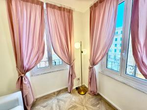 Postel nebo postele na pokoji v ubytování Hotel Astigiana & Appartamenti