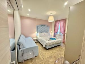 Postel nebo postele na pokoji v ubytování Hotel Astigiana & Appartamenti