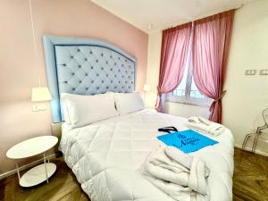 Postel nebo postele na pokoji v ubytování Hotel Astigiana & Appartamenti