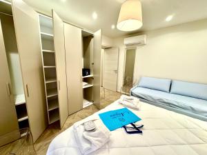 Postel nebo postele na pokoji v ubytování Hotel Astigiana & Appartamenti