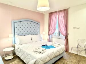 Postel nebo postele na pokoji v ubytování Hotel Astigiana & Appartamenti