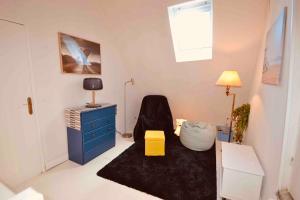 TV a/nebo společenská místnost v ubytování Charmante longère en plein coeur du Perche