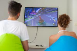 TV a/nebo společenská místnost v ubytování Vila Adrimar