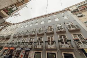 a tall building with balconies on the side of it at Downtown Lisbon Suites by Hosty in Lisbon