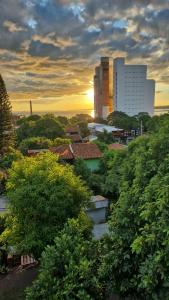 a view of a city with trees and a building at LOFT COSTANERA 200mts in Encarnación
