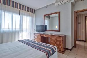 TV a/nebo společenská místnost v ubytování Ripamonti Residence & Hotel Milano