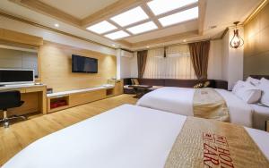 TV a/nebo společenská místnost v ubytování Hotel Zara Gwangju Cheomdan