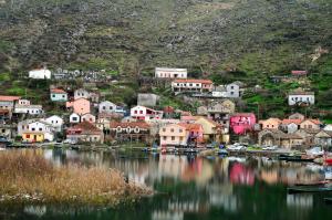 a small town on the shore of a body of water at Apartments Skadar Lake in Vranjina