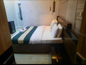 Voodi või voodid majutusasutuse Norvits Hotel Asaba toas