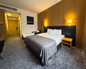 Ένα ή περισσότερα κρεβάτια σε δωμάτιο στο GAZDA Hotel&Restaurant - Self Chek-In