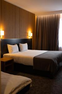 Ένα ή περισσότερα κρεβάτια σε δωμάτιο στο GAZDA Hotel&Restaurant - Self Chek-In