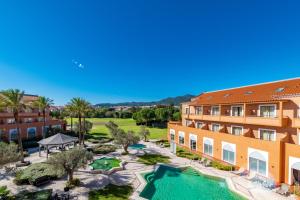 an aerial view of a resort with a swimming pool at Pestana Sintra Golf Resort & SPA Hotel in Sintra