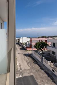 a view of an empty street from a building at Centonze appartamenti in San Foca
