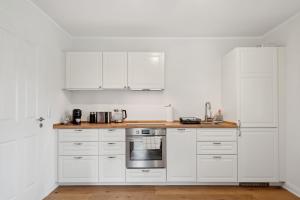 Η κουζίνα ή μικρή κουζίνα στο Ferienhaus "Deichperle" mit Flussblick