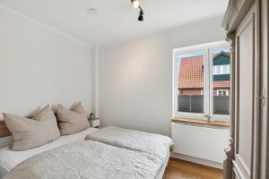 Ένα ή περισσότερα κρεβάτια σε δωμάτιο στο Ferienhaus "Deichperle" mit Flussblick