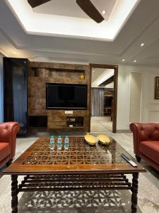 Posezení v ubytování Luxury Apartment In Indiranagar