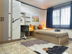Ένα ή περισσότερα κρεβάτια σε δωμάτιο στο Ten Place at Srinakarin +102 φωτογραφίες