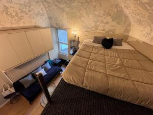 a bedroom with a large bed and a window at Via Corradi in Sanremo