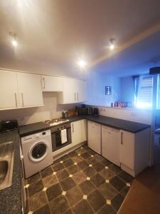 Kuchyň nebo kuchyňský kout v ubytování Stevenson Apartment in Oban City + 8 fotografií