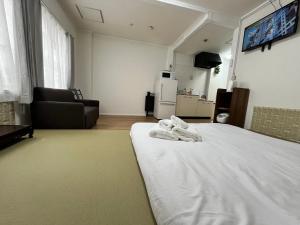 Katil atau katil-katil dalam bilik di 清の泉民泊-菊207