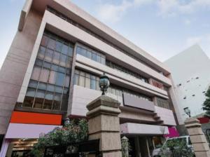 a building with a street light in front of it at Hotel Saiprakash in Hyderabad
