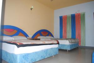 Ένα ή περισσότερα κρεβάτια σε δωμάτιο στο Hotel Sea Alif