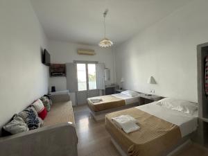 Rúm í herbergi á Hotel Hellas