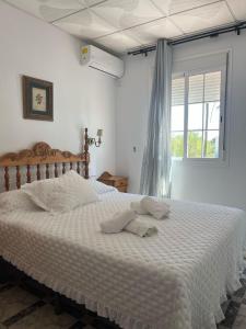 Postel nebo postele na pokoji v ubytování Hostal Quinto Pino